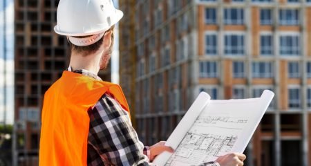 medium-shot-side-view-engineer-holding-plans